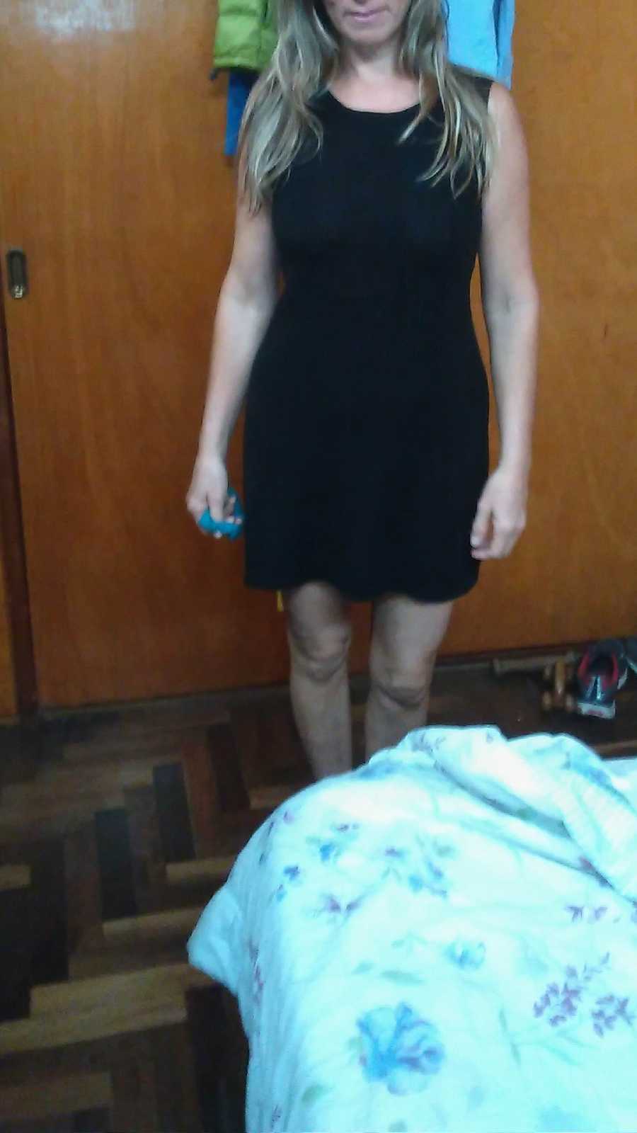 Bending over in a Black Dress