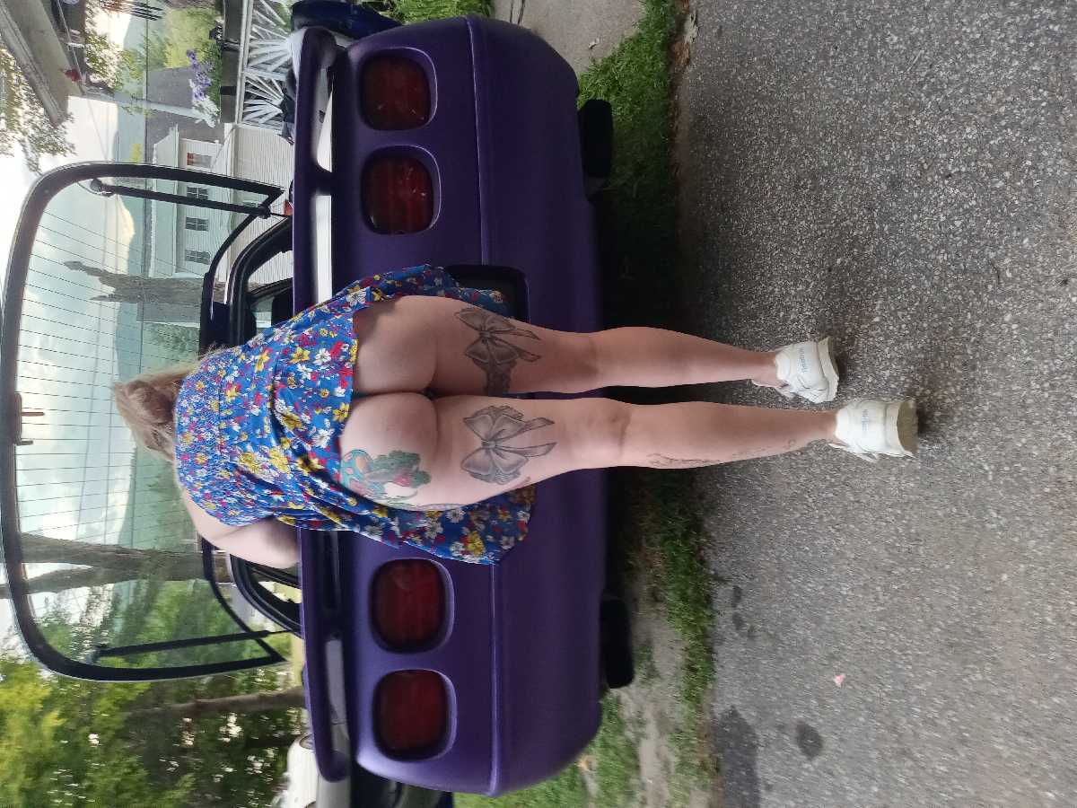 Bending over the Car