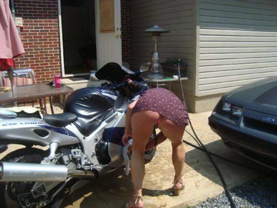 Washing Motorcycle in a Thong