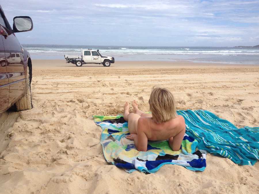 Laying Nude on the Beach