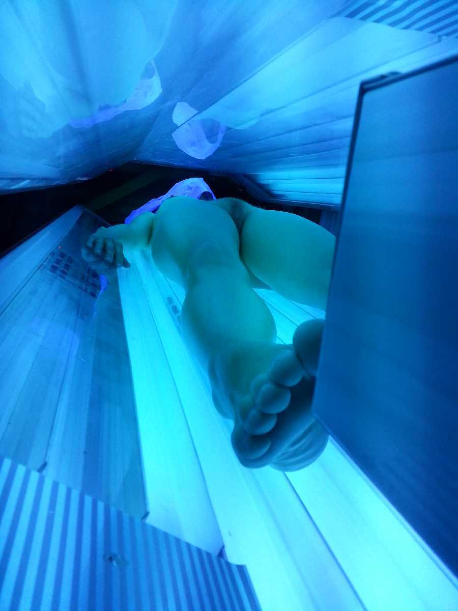 Nude in Tanning Bed