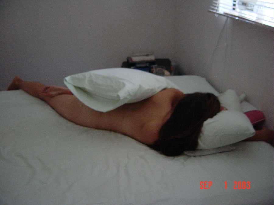 Nude Behind Pillows