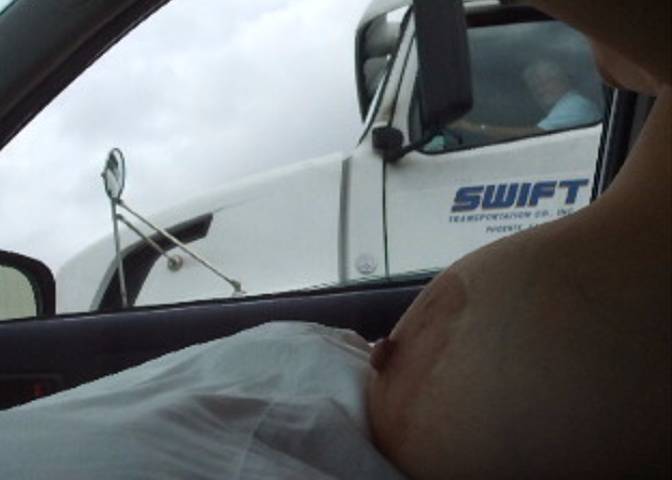 Wife Flashing Truck Drivers her Big Tits on the Freeway