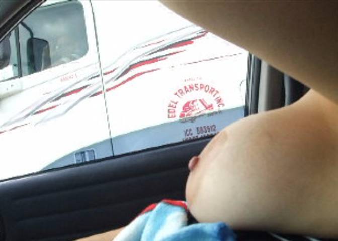 Wife Flashing Truck Drivers her Big Tits on the Freeway