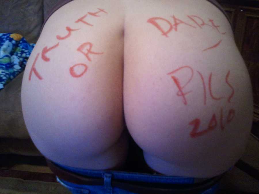 Green Eyes on my wife with a bare bum with writing on it