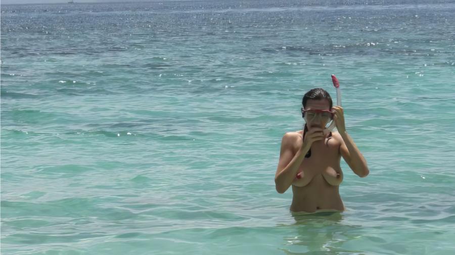 Amateur Girlfriend coming out of the water topless after snorkling