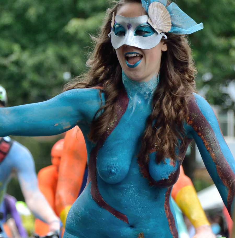 Naked Woman Painted in Blue on a Bike Parade